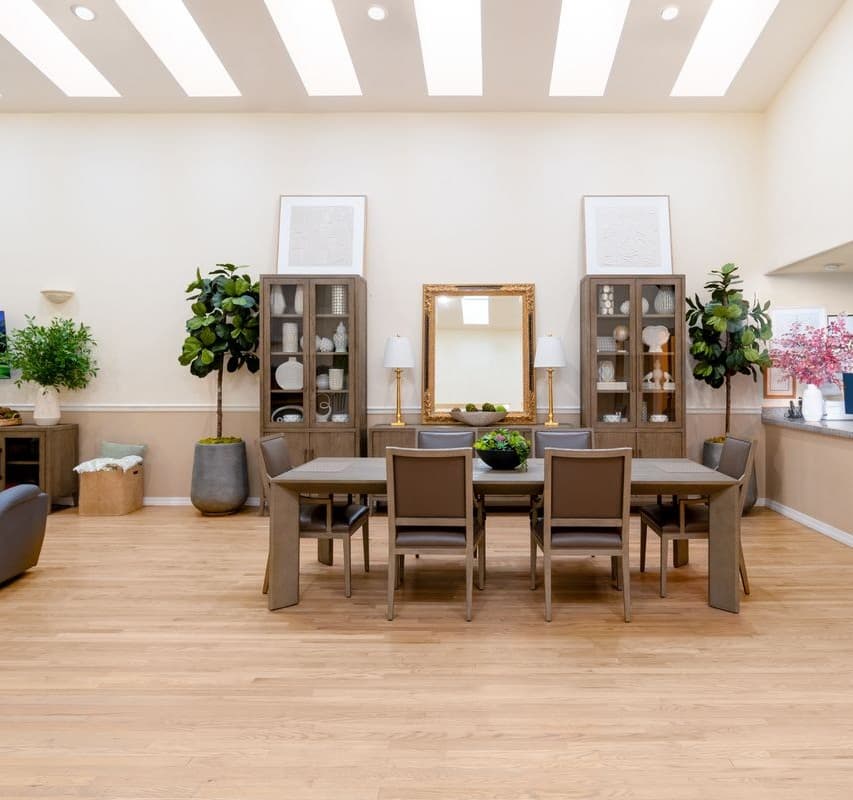 Senior couple smiling together in a warm, home-like environment